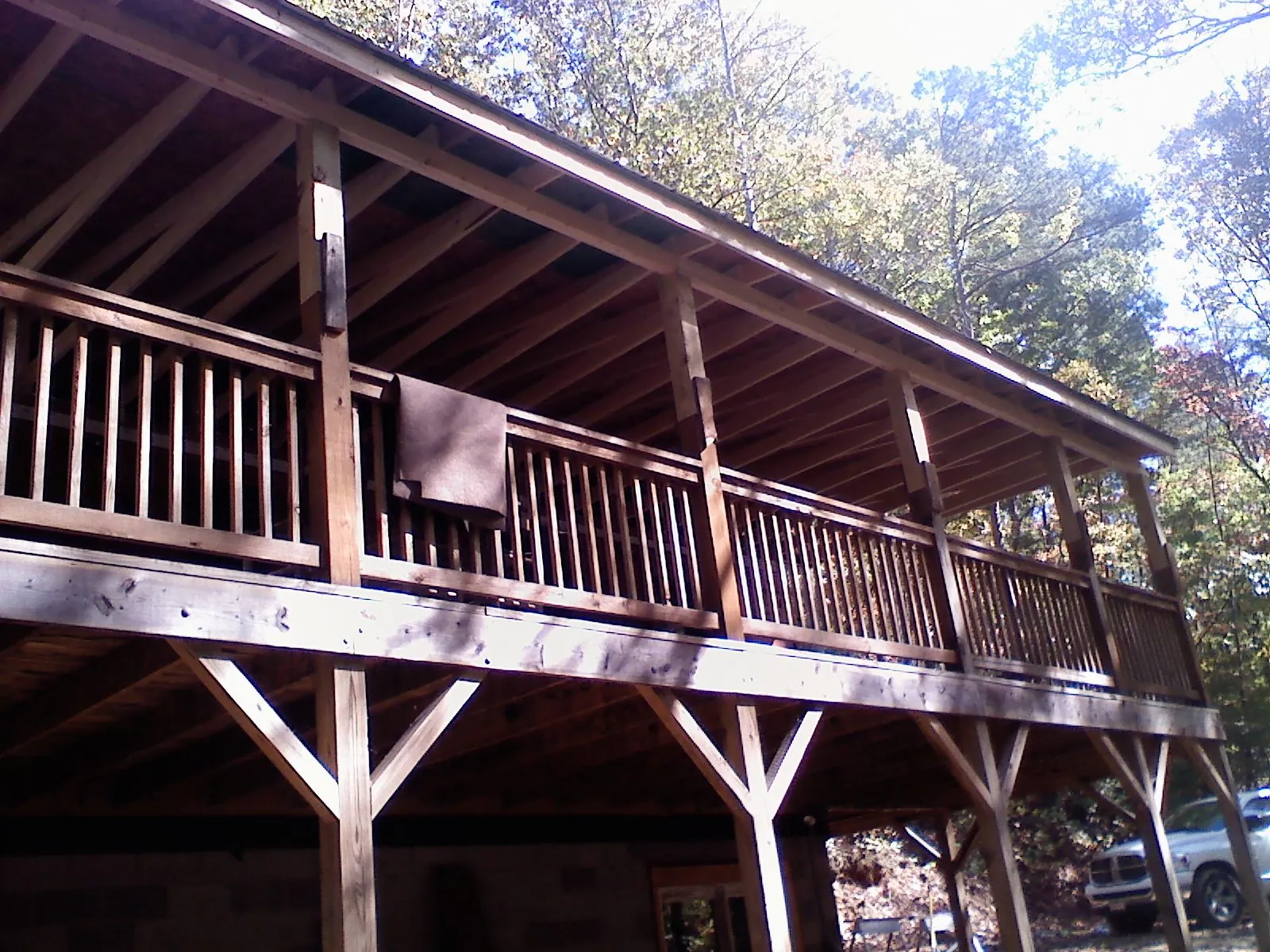 Timber framing under a new elevated porch and deck — Roof Leak Repair in Muskegon by Roofing Brothers